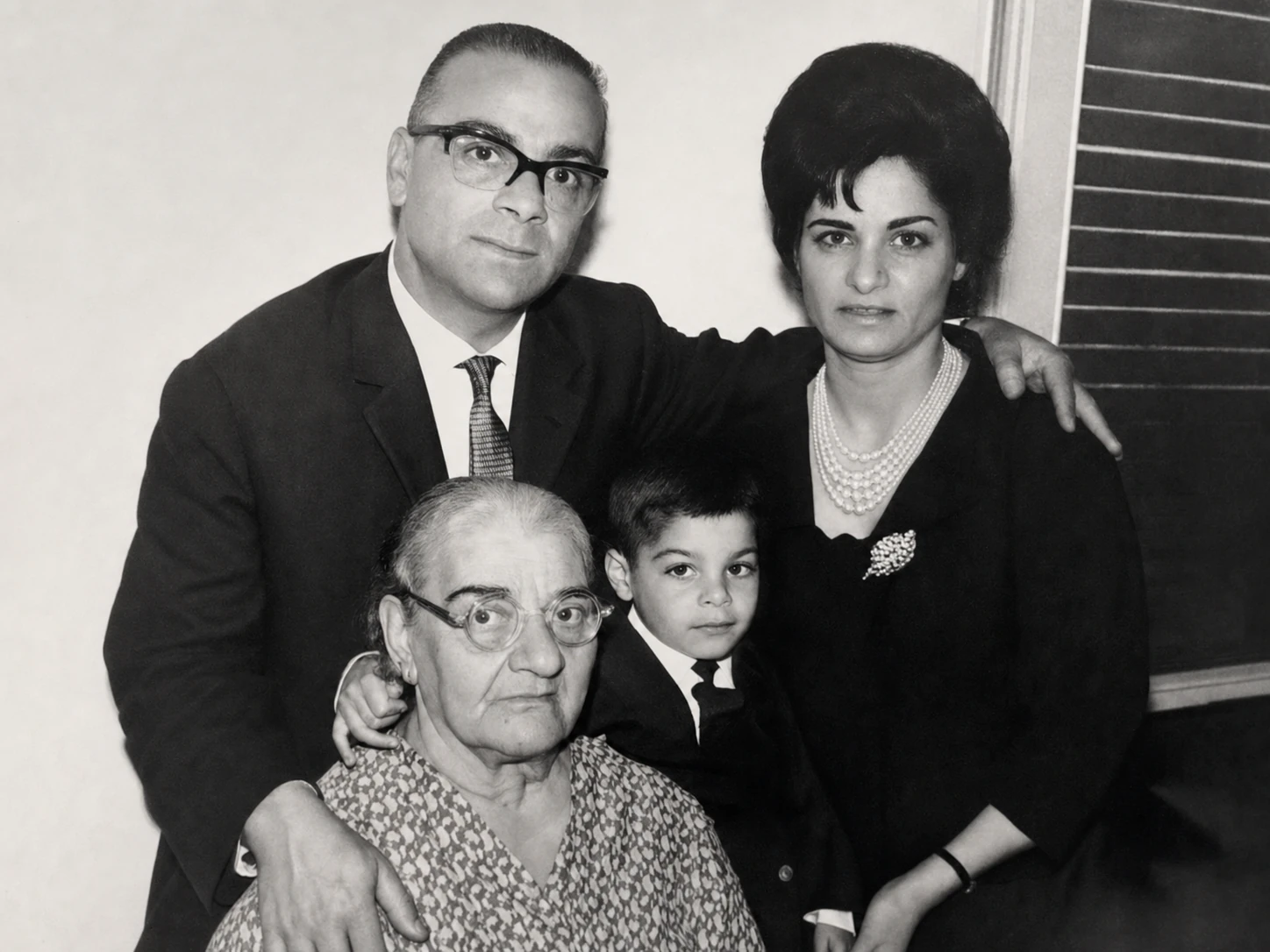 The Inbari family gathered for a formal black-and-white portrait.